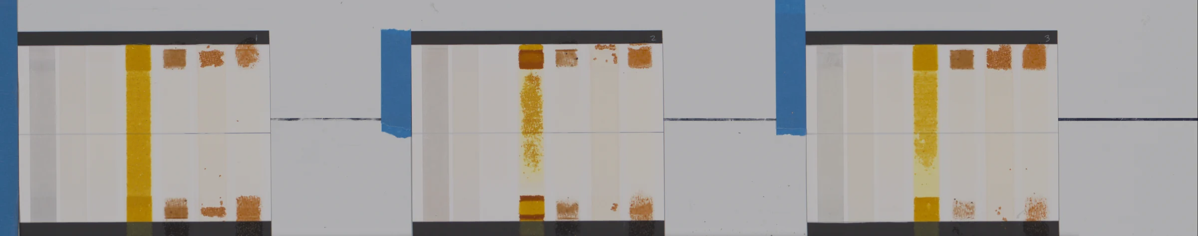 One pass of the scanner: three test boards lying on the deck, end to end